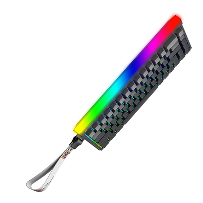 Compact gaming keyboard with rainbow RGB edge glow and white wrist strap