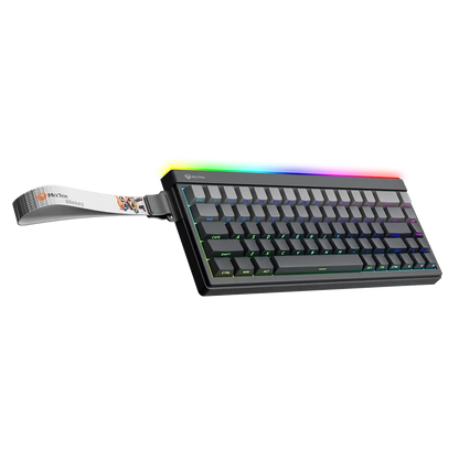 Gaming keyboard with rainbow RGB backlit keys, black body, wrist rest strap attached