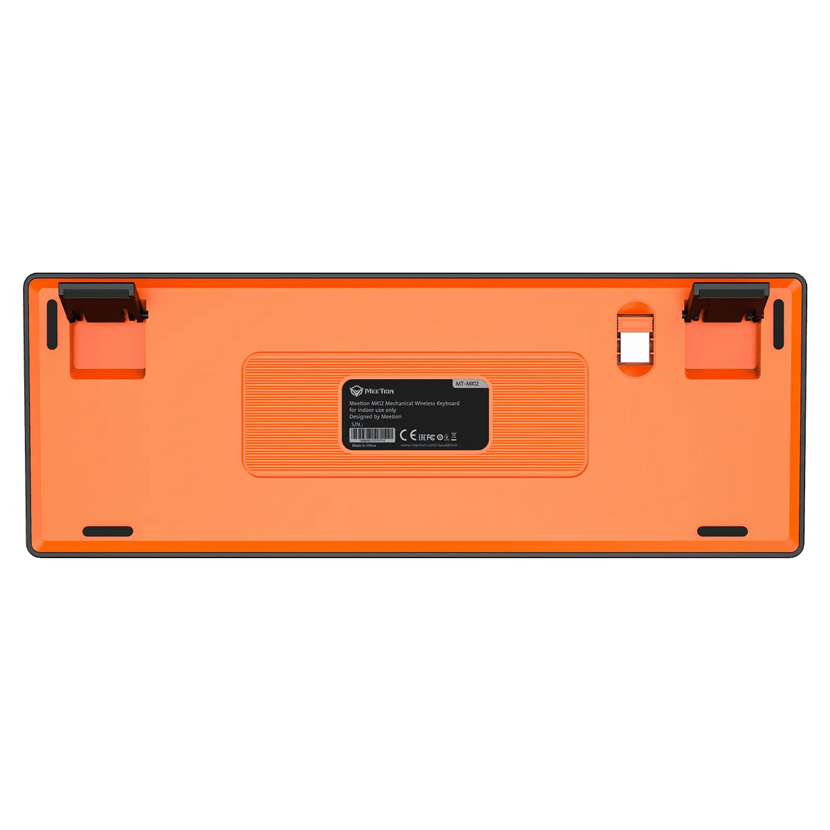 Bottom of orange mechanical keyboard with label, switches, and feet