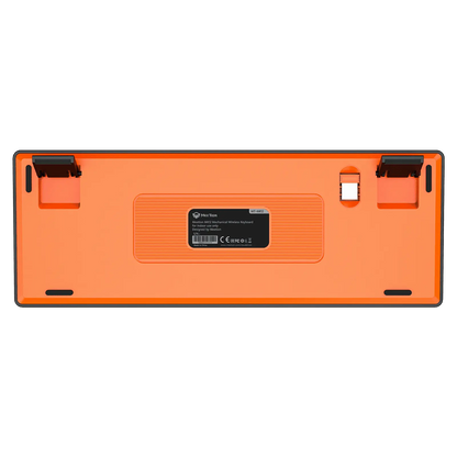 Bottom of orange mechanical keyboard with label, switches, and feet